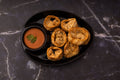 Fried momos with dipping sauce